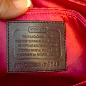 Coach navy brushed patent leather bag.